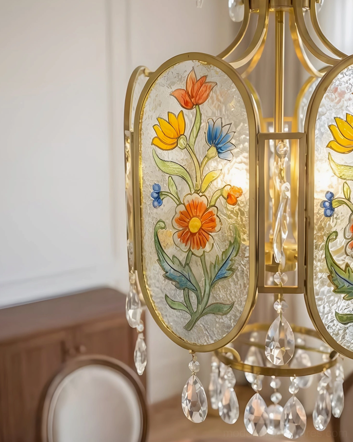 Hand-painted floral pendant light with crystal accents casting decorative light patterns in French country home interior