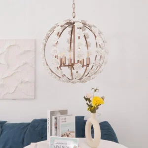 Hanging floral pendant chandelier in modern living room with blue sofa, three-quarter angle