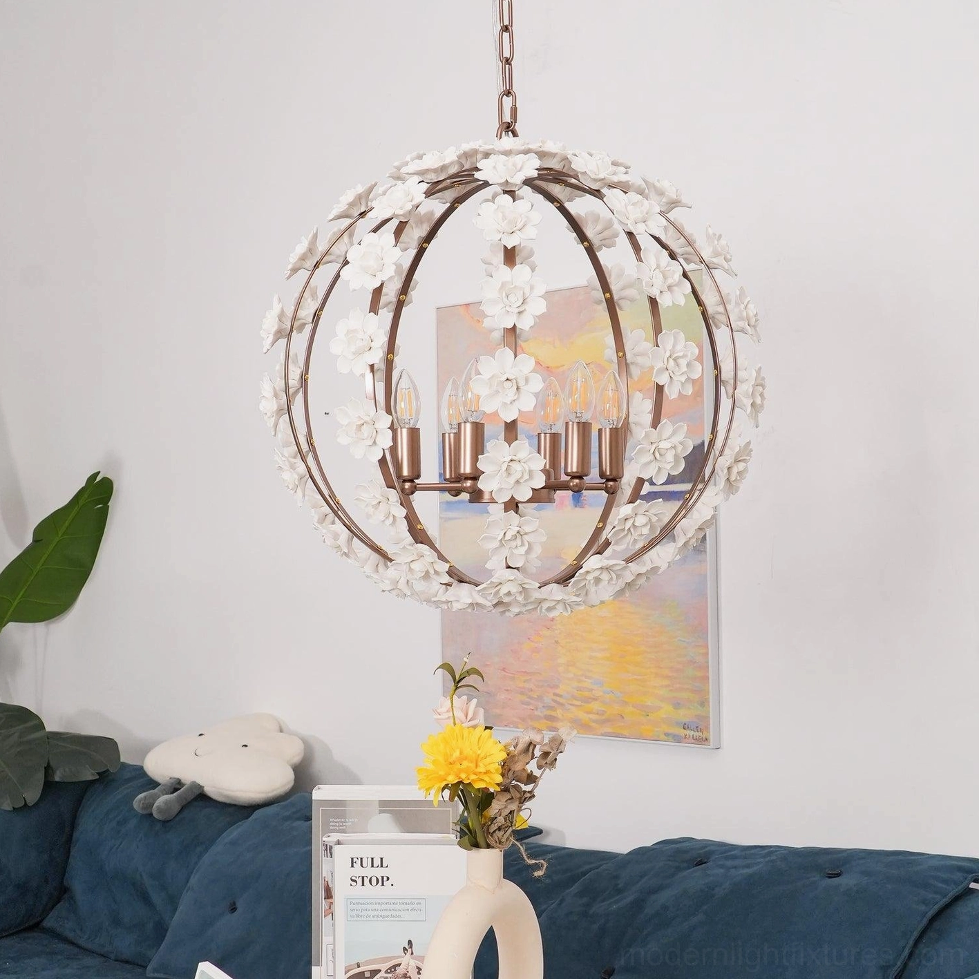 Floral globe pendant light in modern living room with sofa and landscape artwork