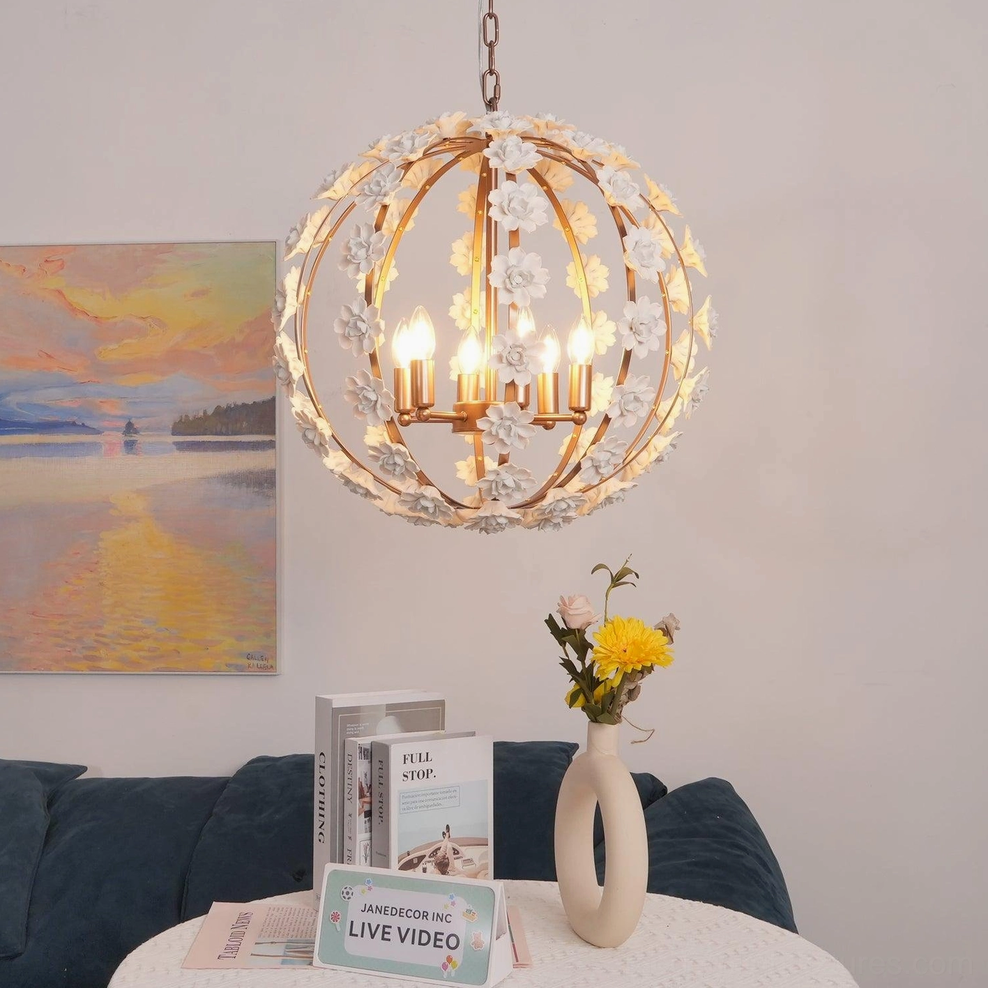 Hanging floral globe pendant light three-quarter view with warm lit bulbs and subtle flower details