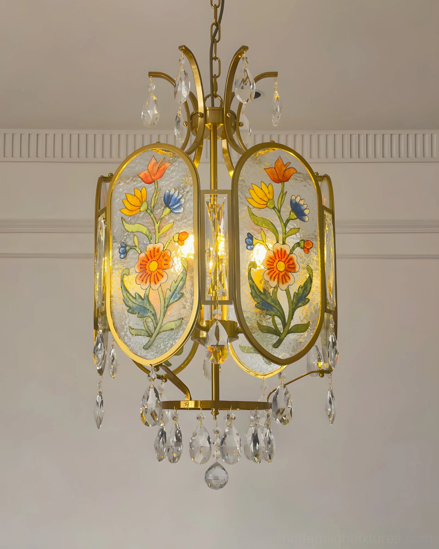 Jardinelle floral pendant light with textured hand-painted glass panels diffusing warm light in elegant interior setting