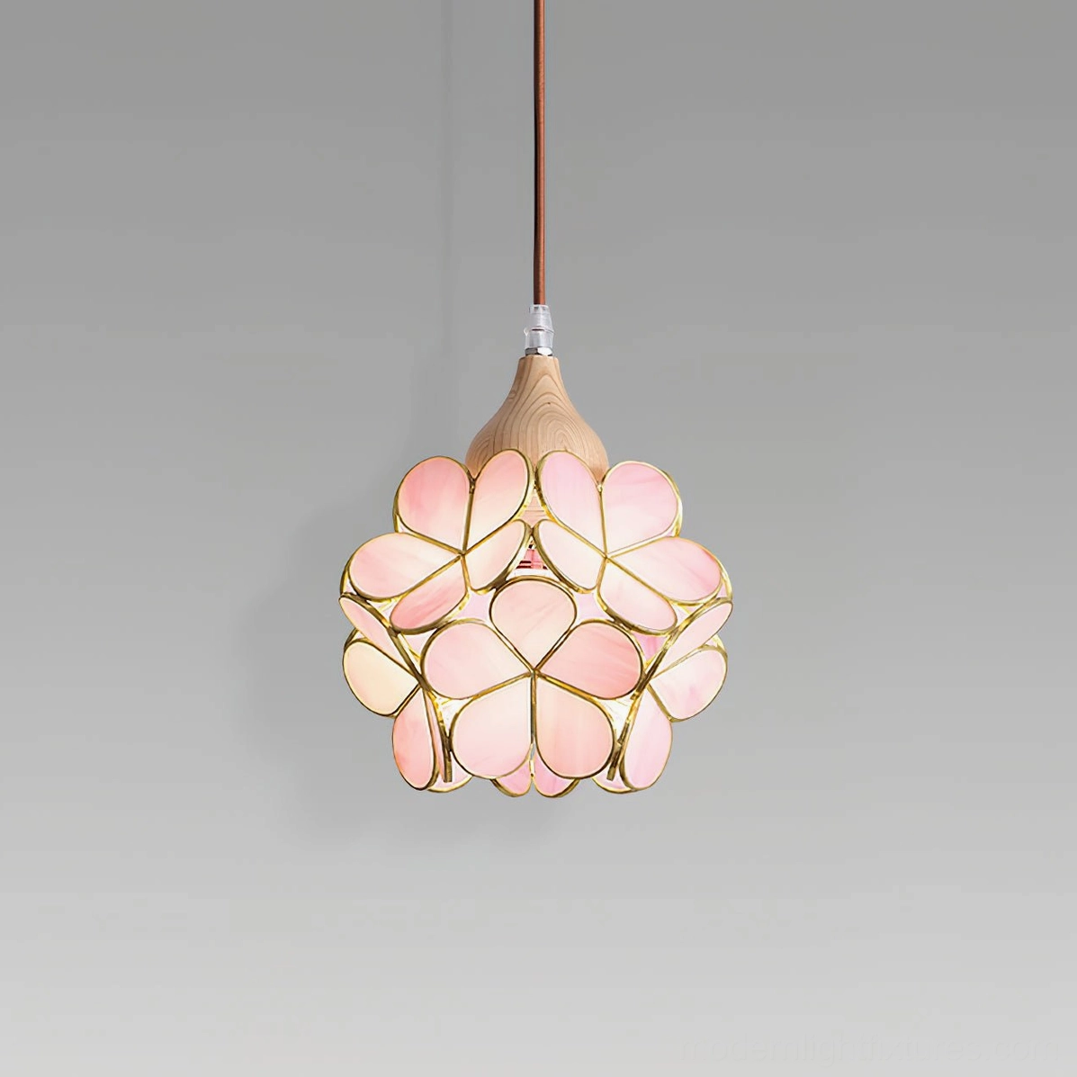 Artisan stained glass flower pendant light studio shot, pink glass petals with gold metal accents and wooden ceiling cap