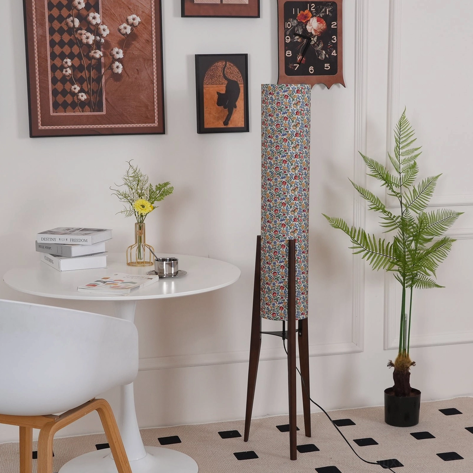 Floral tripod floor lamp with wood base providing warm decorative lighting for eclectic bohemian modern spaces