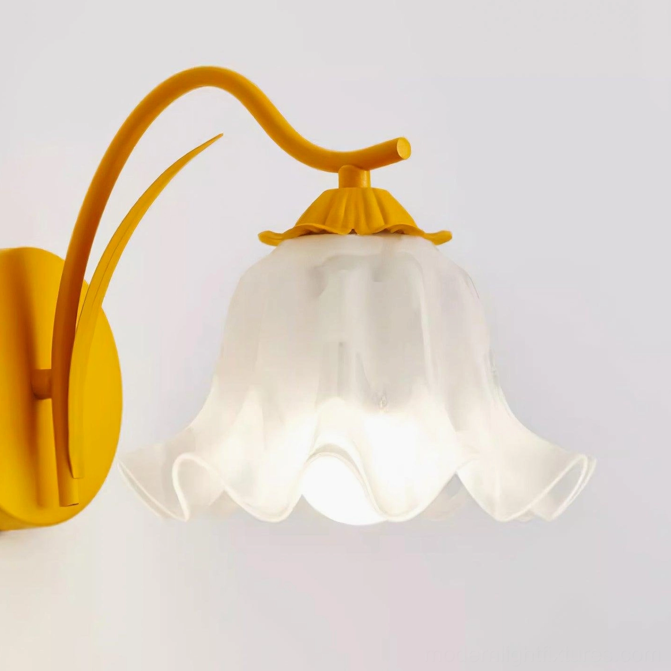 Botanical modern wall light with metal frame construction and petal-shaped shade