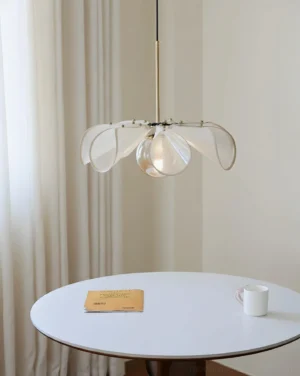 Florello sculptural pendant lamp in minimalist dining nook interior with neutral warm styling