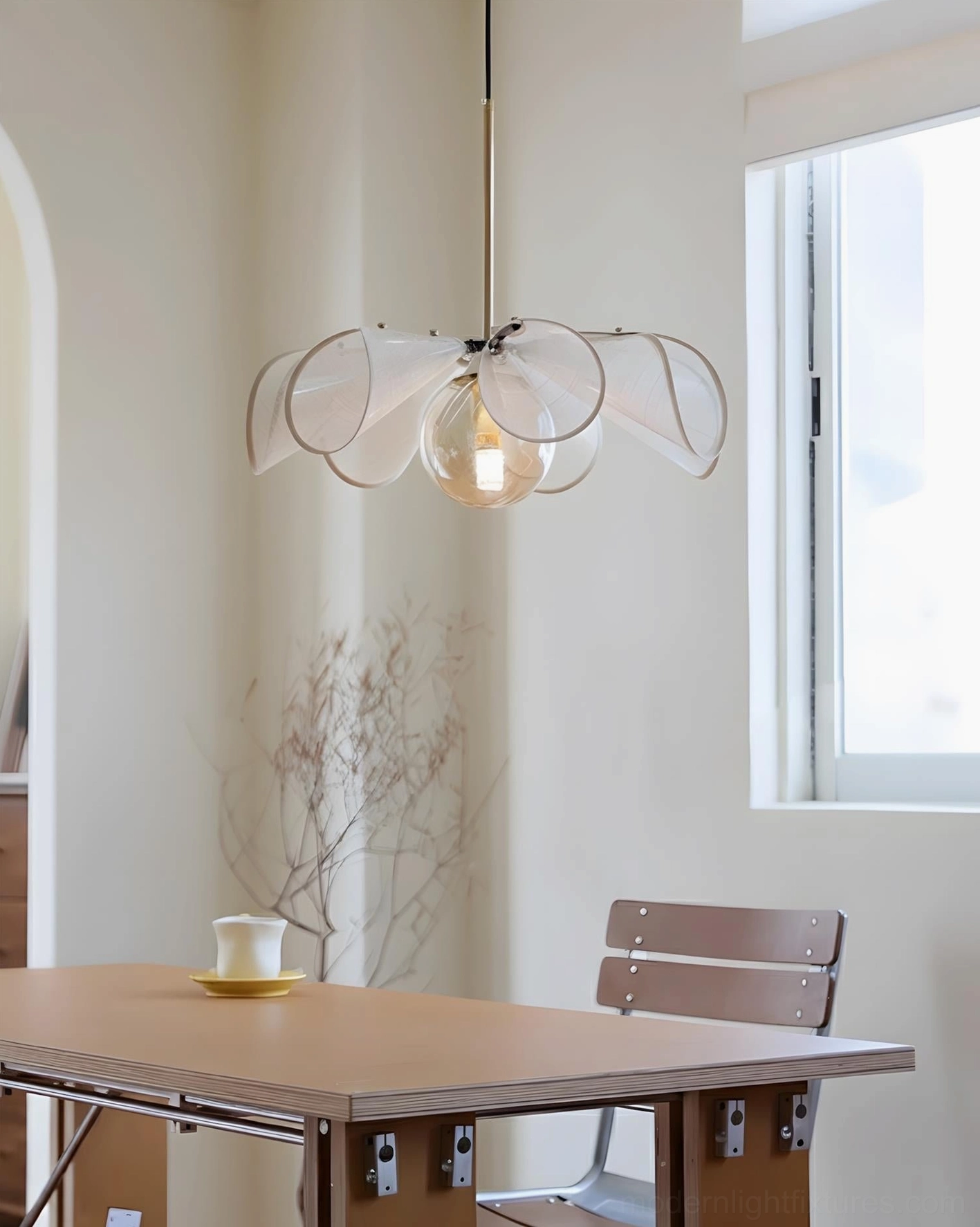 Florello petal-shaped pendant lamp low-angle side view in wooden dining nook with warm interior styling