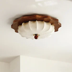 Overhead view of Florence ceiling lamp showing scalloped shell-inspired shade design and dark wood finial detail