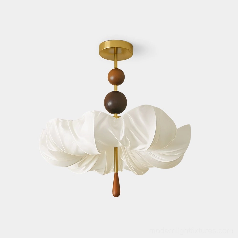 Floretta petal ceiling light fixture with sculptural fabric shade, brass base, and wooden bead details in studio view