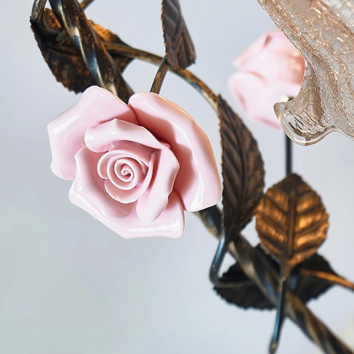 Detailed view of Florielle table lamp porcelain rose ornaments and antique gold metal leaf accents