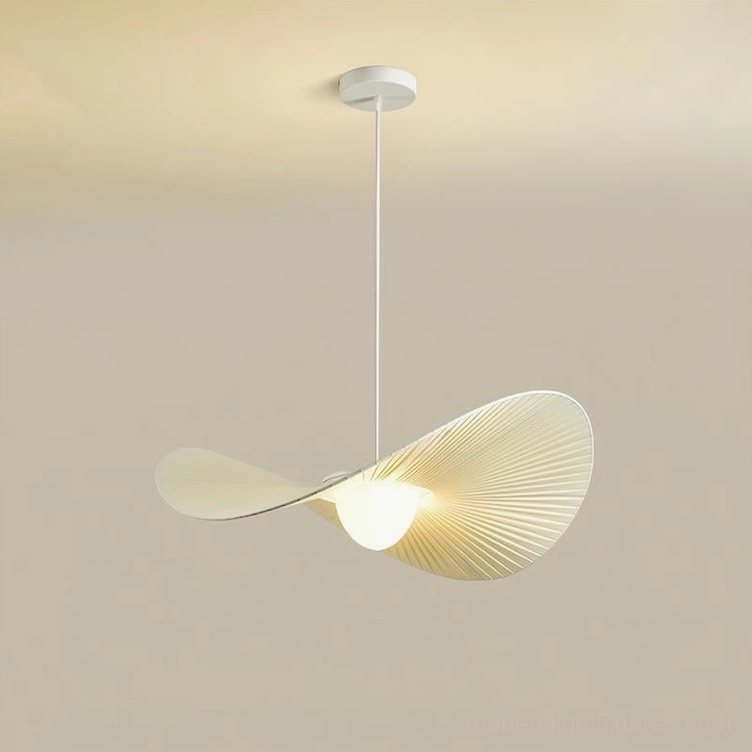 Florina pendant light side three-quarter view displaying asymmetrical pleated shade design in warm beige fabric against studio background