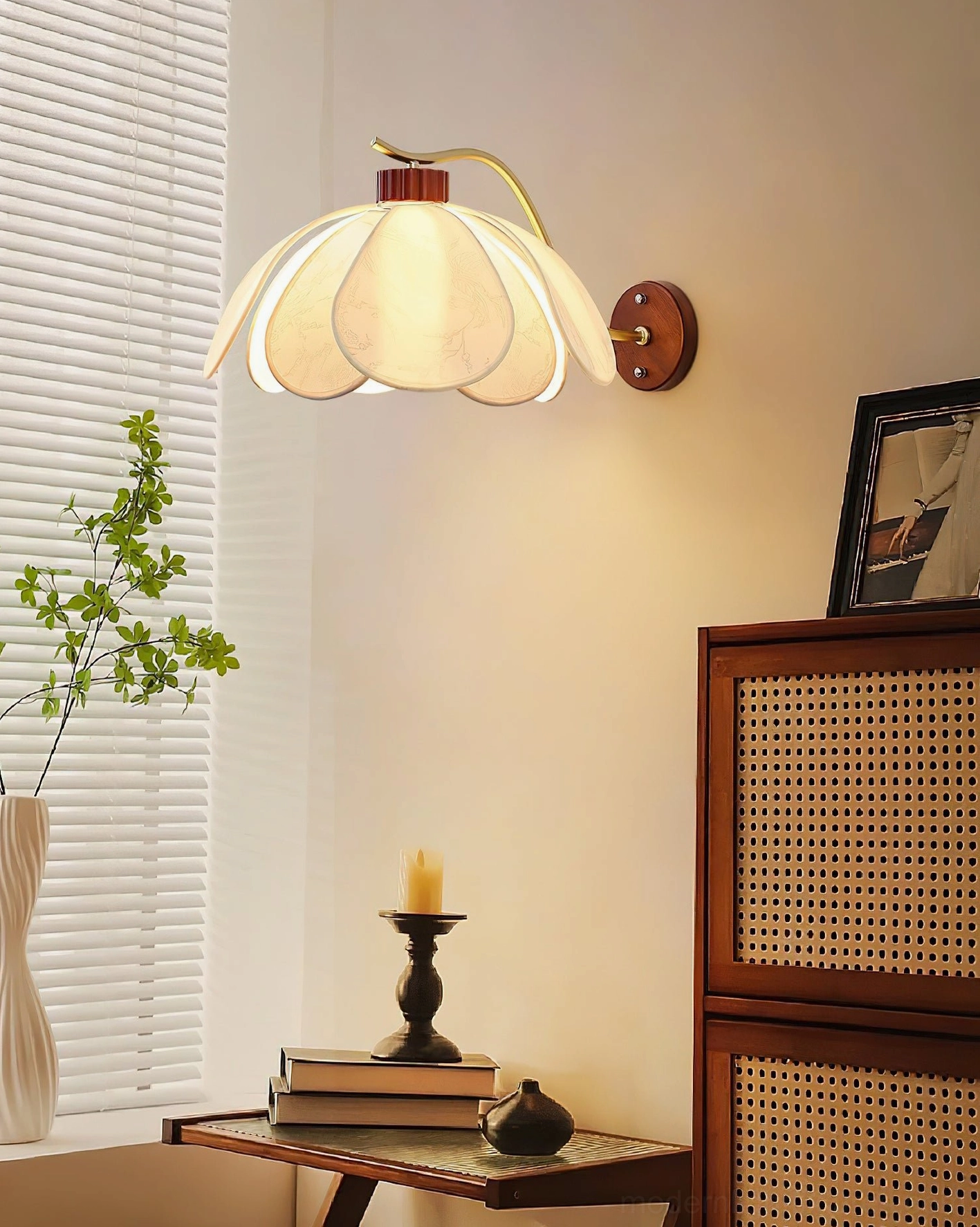 Florvia petal wall lamp in cozy living room scene with rattan furniture and warm ambient lighting creating botanical-inspired décor