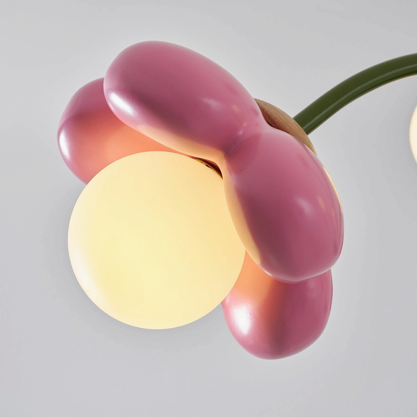 Flower ceiling fixture artistic lighting showing warm glow emanating from individual flower shapes