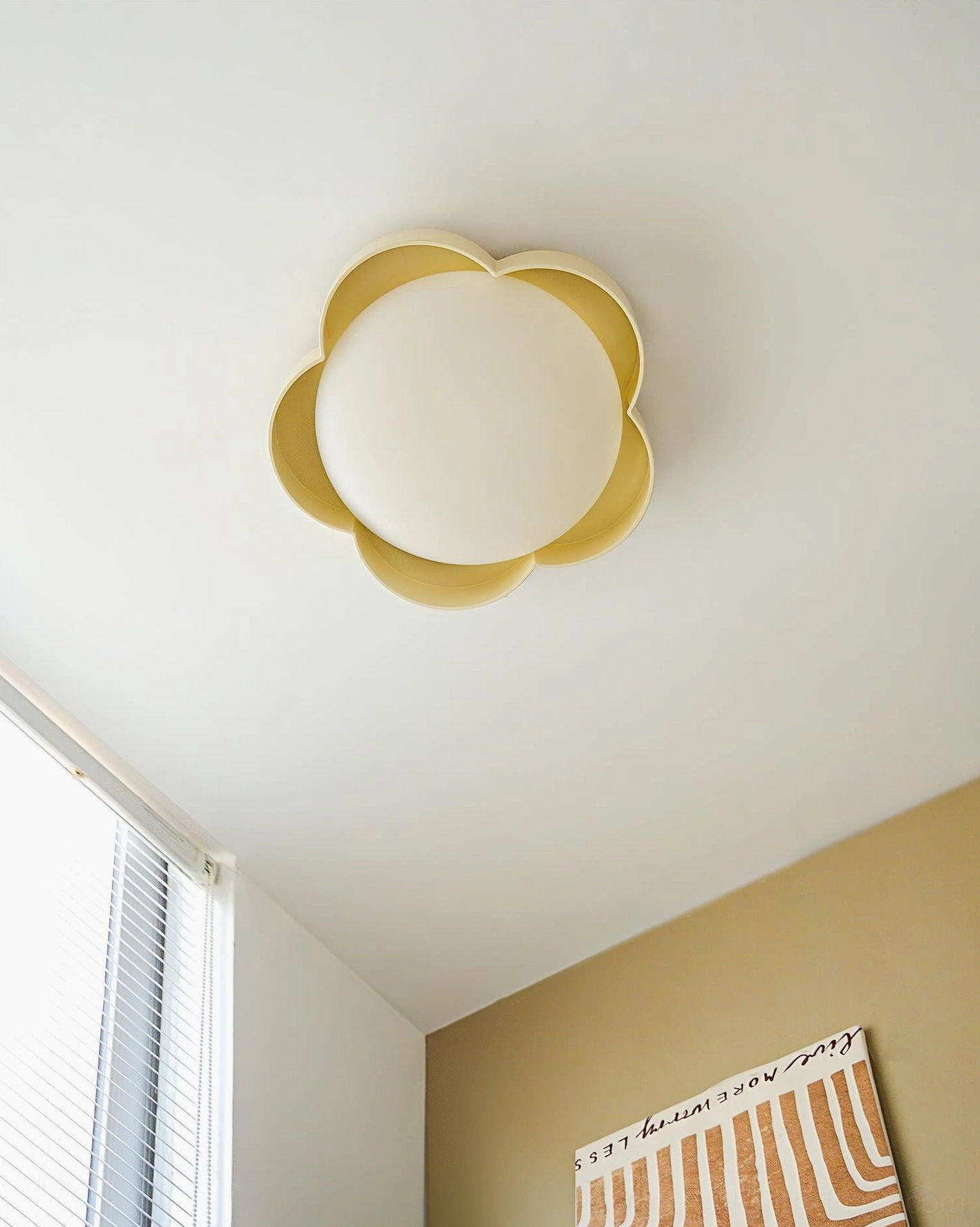 Warm yellow and creamy white double-layered flower ceiling light fixture - close-up studio view