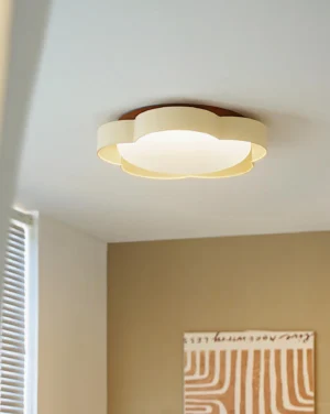 Flower ceiling lamp installed in warm neutral bedroom - modern flush mount light with wood trim