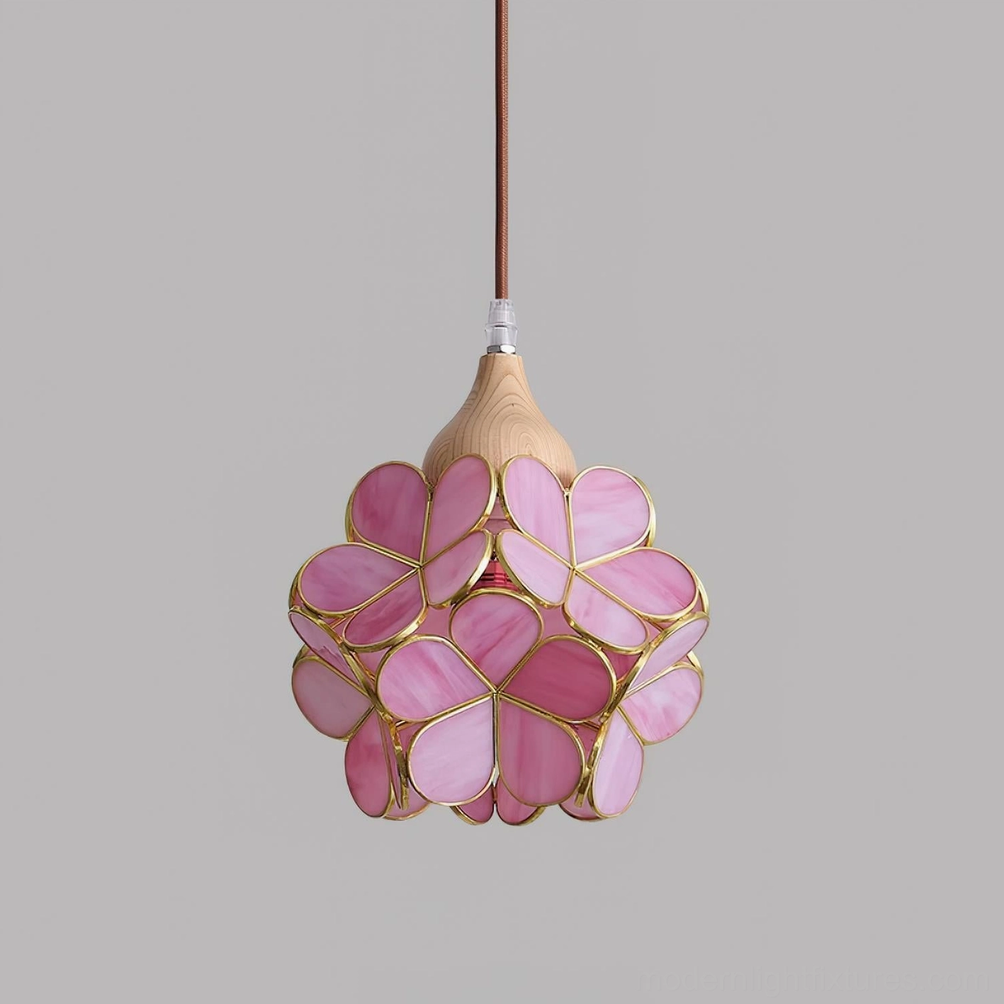 Stained glass flower pendant light installation in minimalist modern bedroom with neutral palette