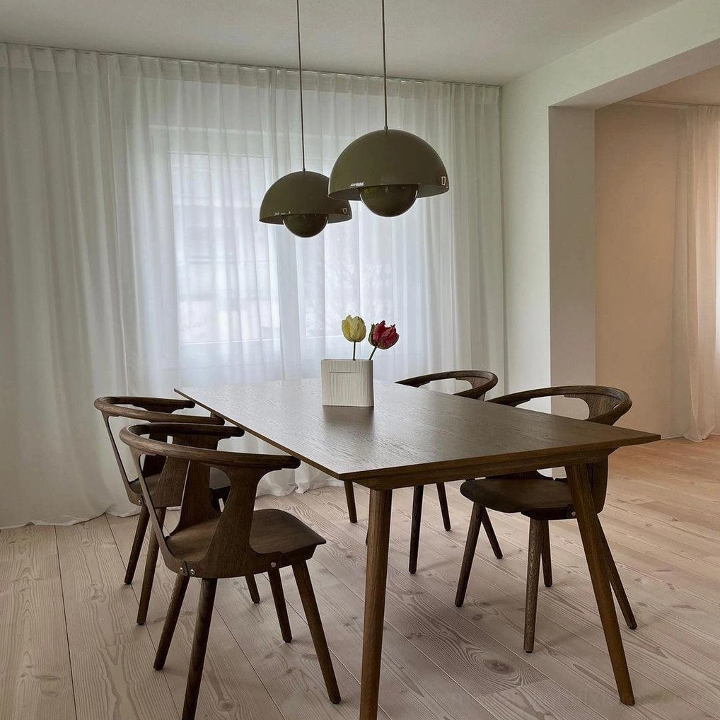 Flowerpot pendant light in beige finish creating warm neutral backdrop in living space