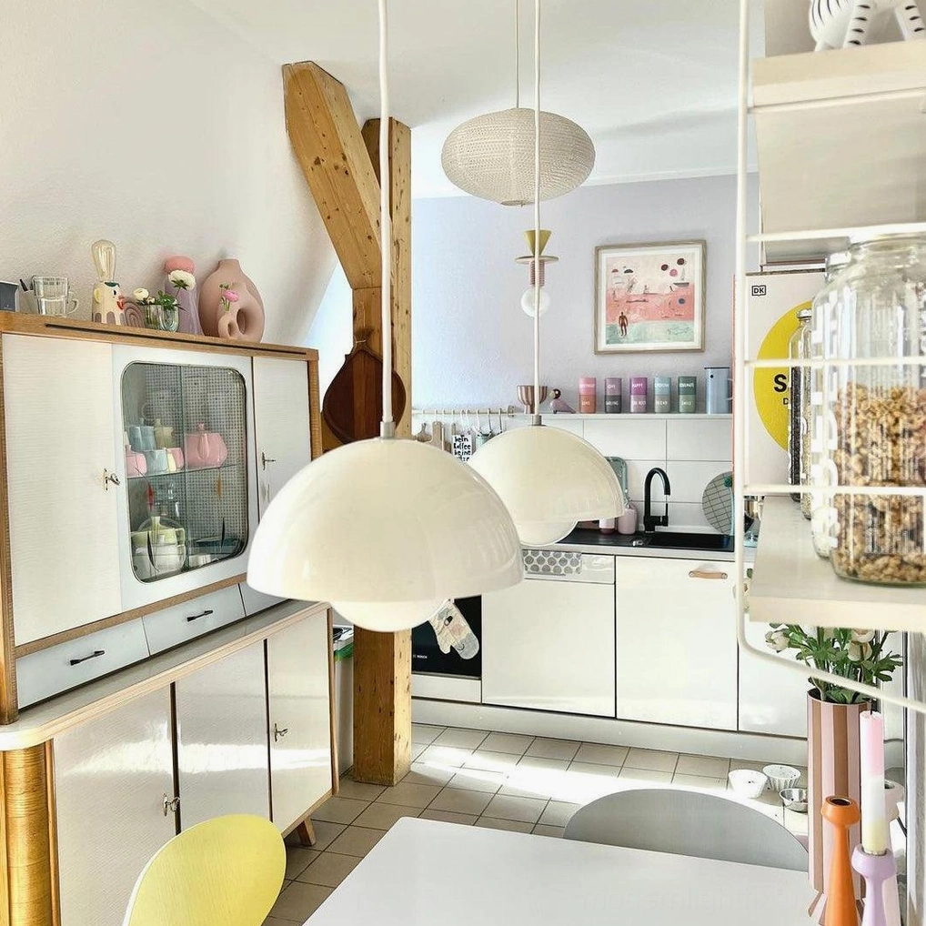 Chrome Flowerpot pendant light with metallic reflective finish in contemporary interior setting