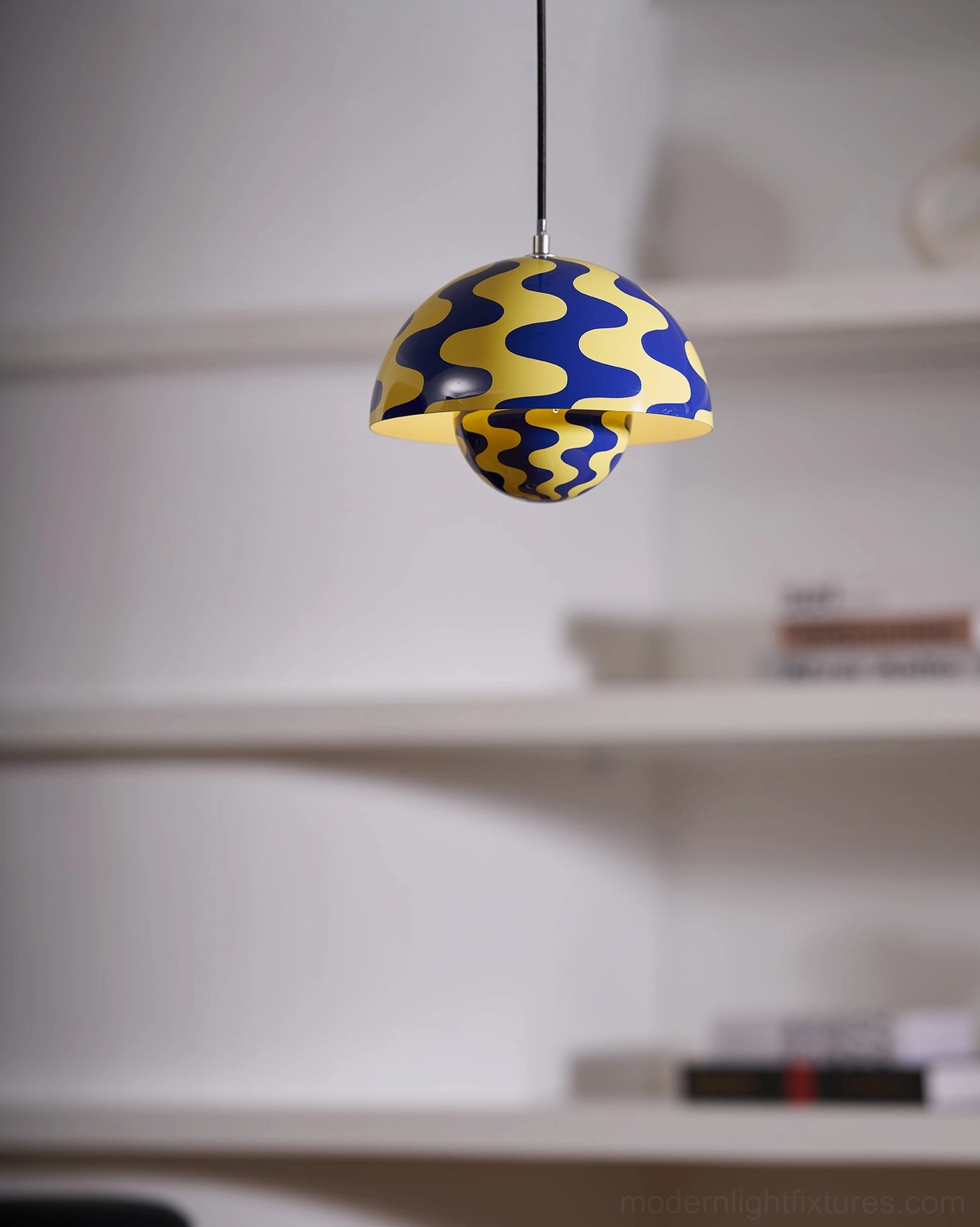 Flowerpot pendant light in contemporary kitchen showing transition to adjacent living space