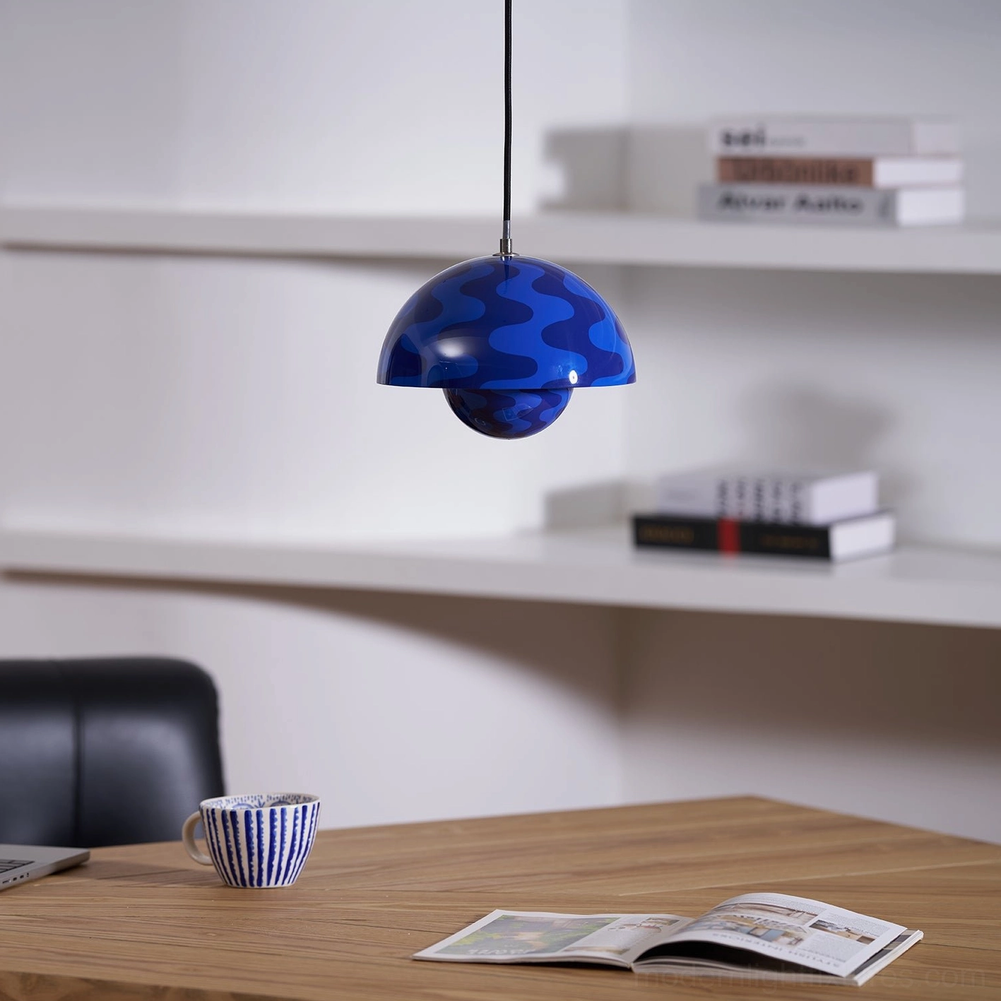 Flowerpot pendant light above intimate dining setting with warm ambient atmosphere