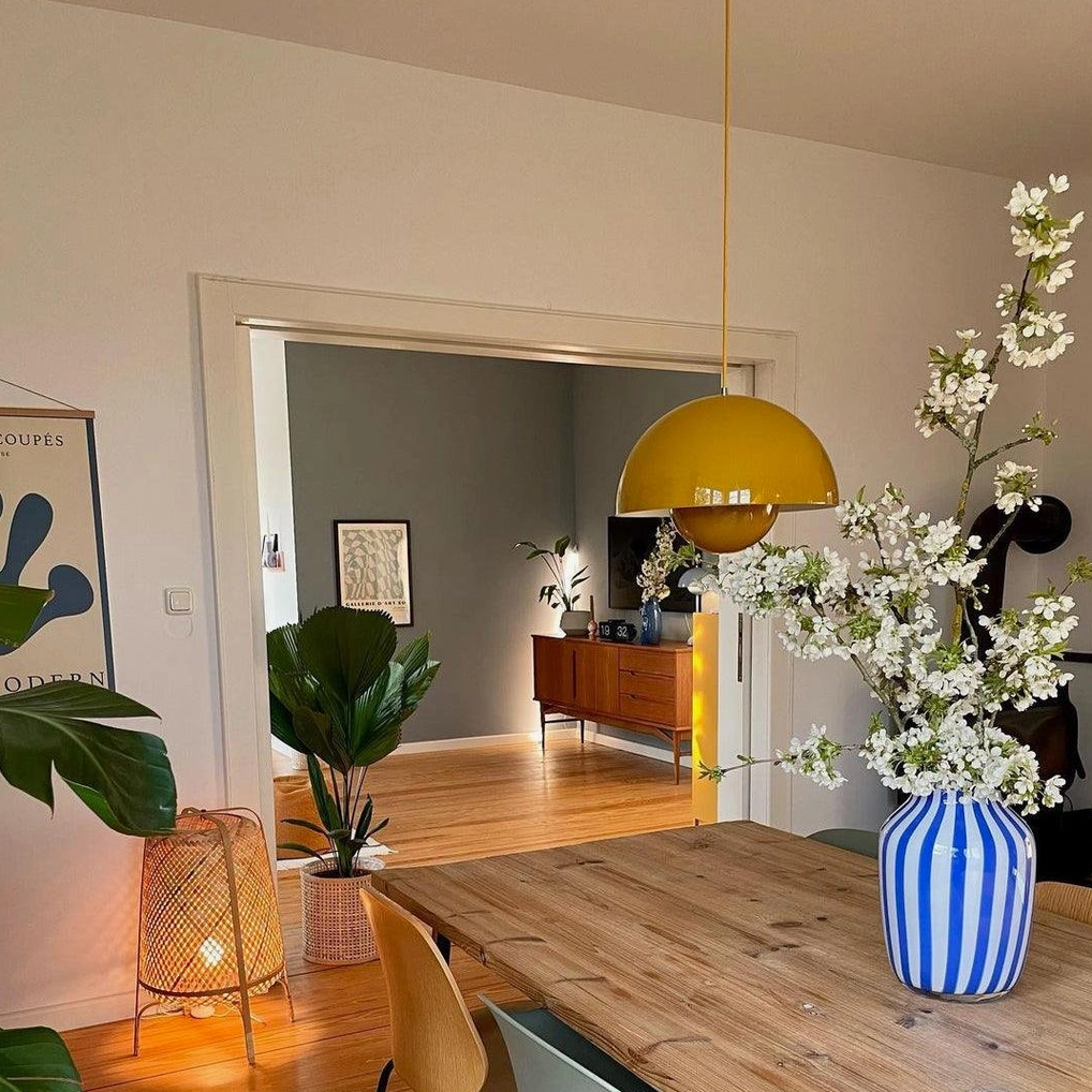 Flowerpot pendant light above kitchen counter providing focused work surface illumination