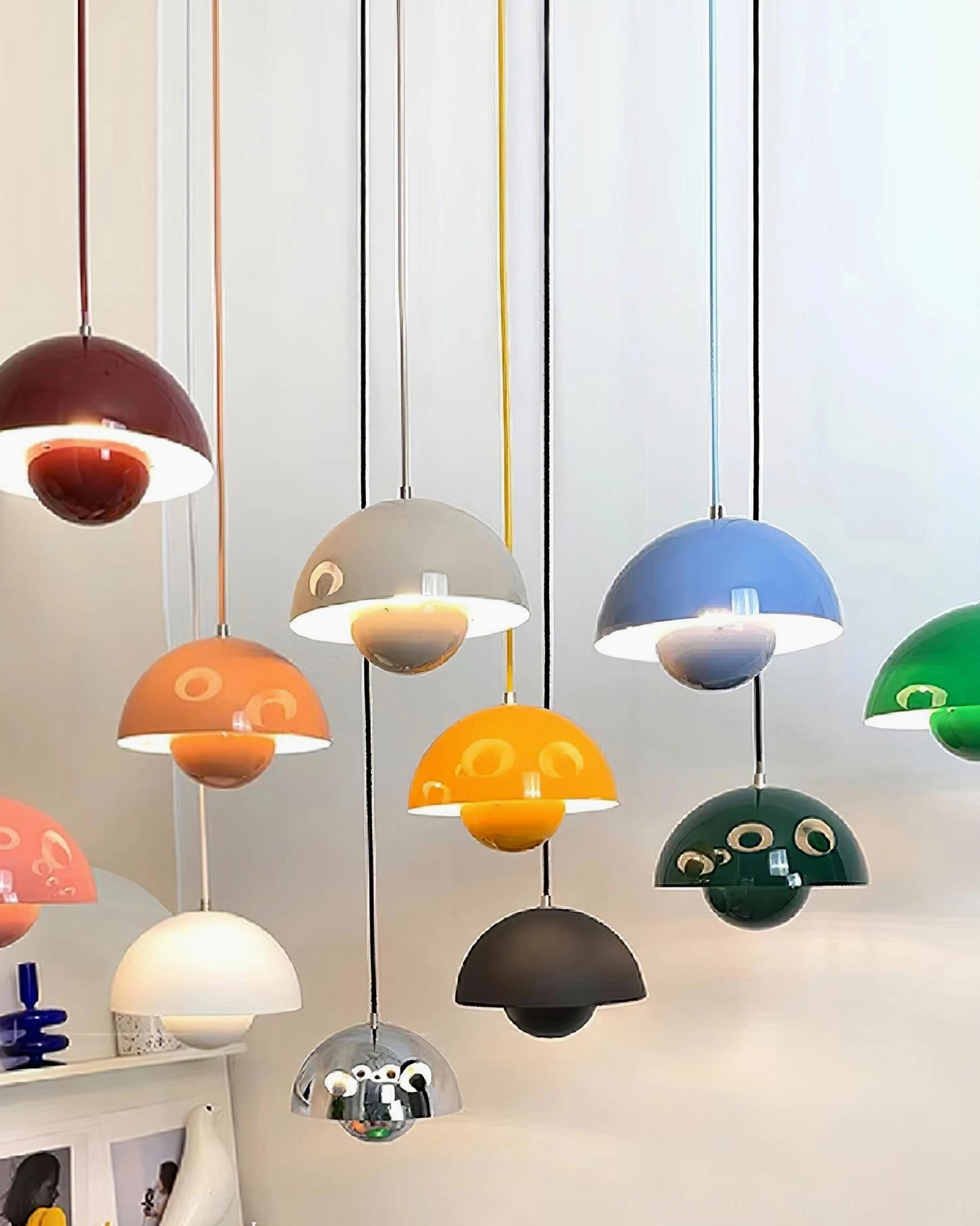 Flowerpot pendant light in open-plan loft space defining functional lighting zones