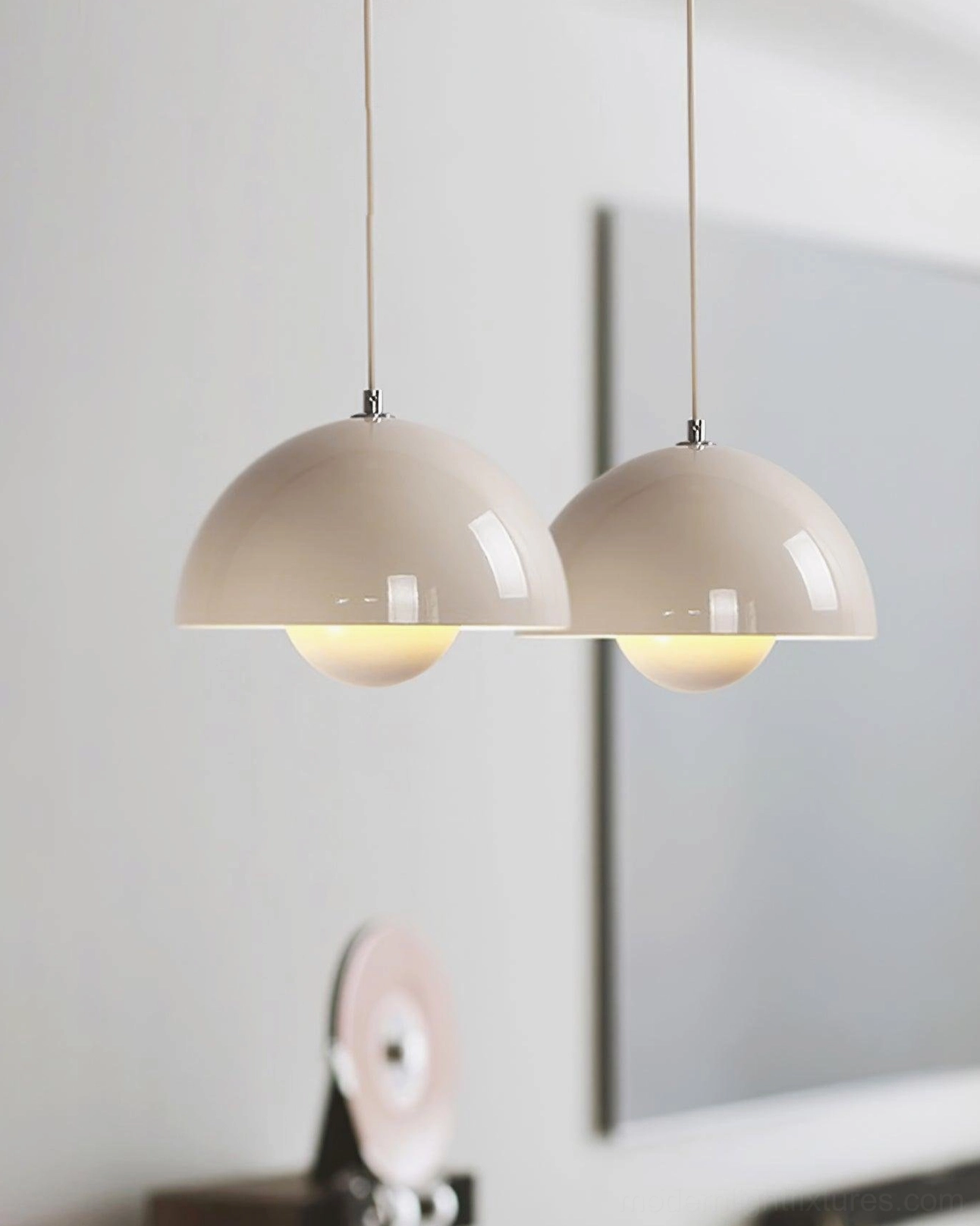 Flowerpot pendant light in mixed size grouping creating visual rhythm and depth
