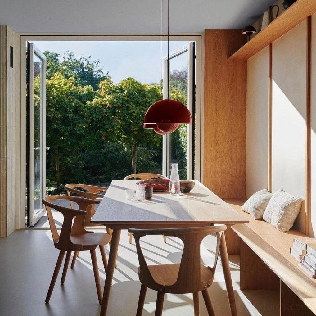 Dark red Flowerpot pendant light in contemporary dining room with wooden table and minimalist aesthetic