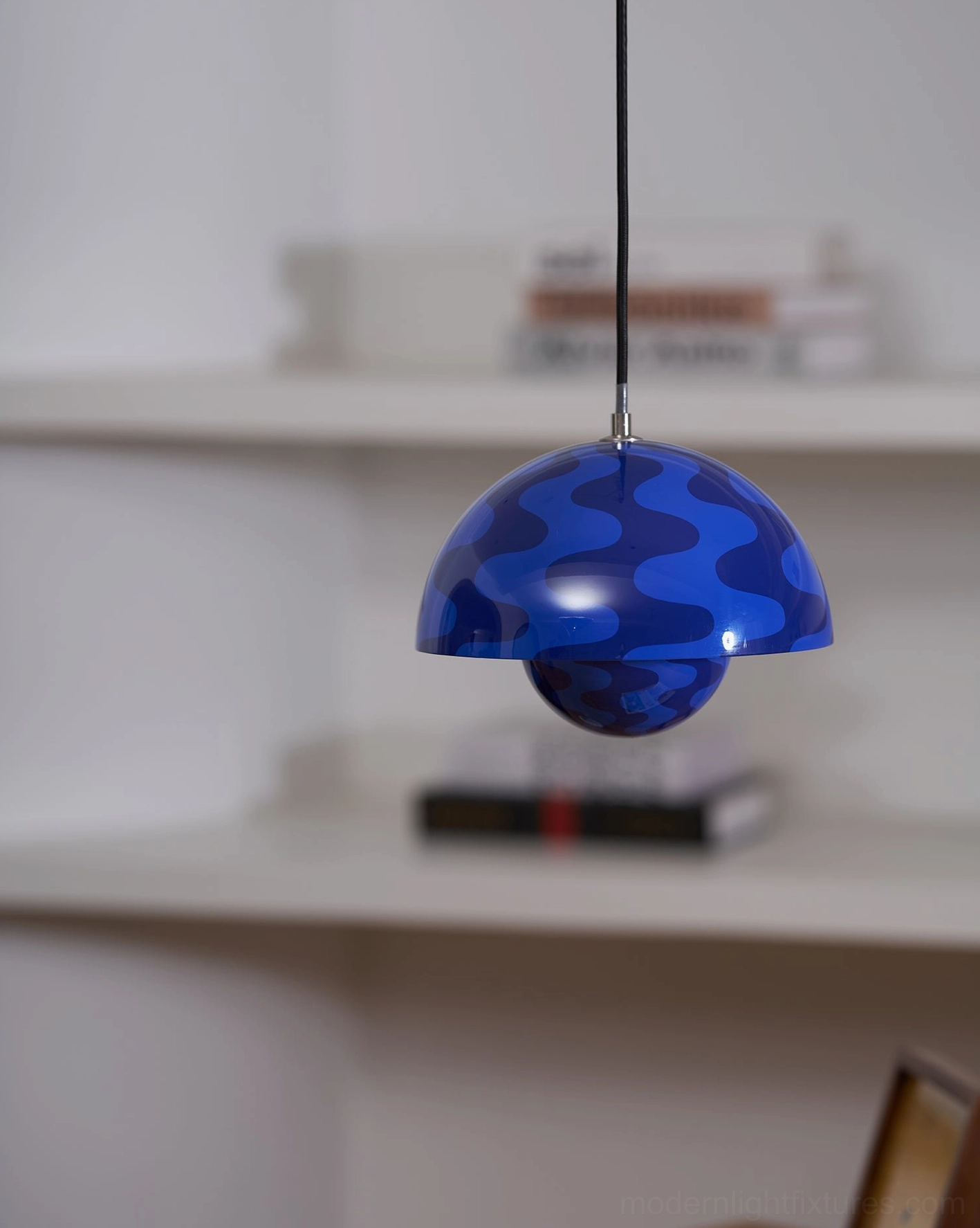 Flowerpot pendant light creating visual focus point in open-plan living dining area