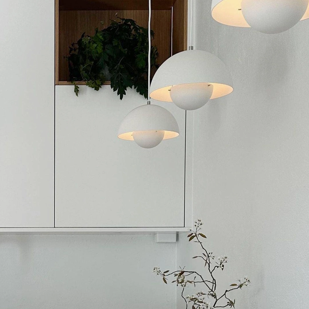 Flowerpot pendant light in matte white finish in bright modern dining space