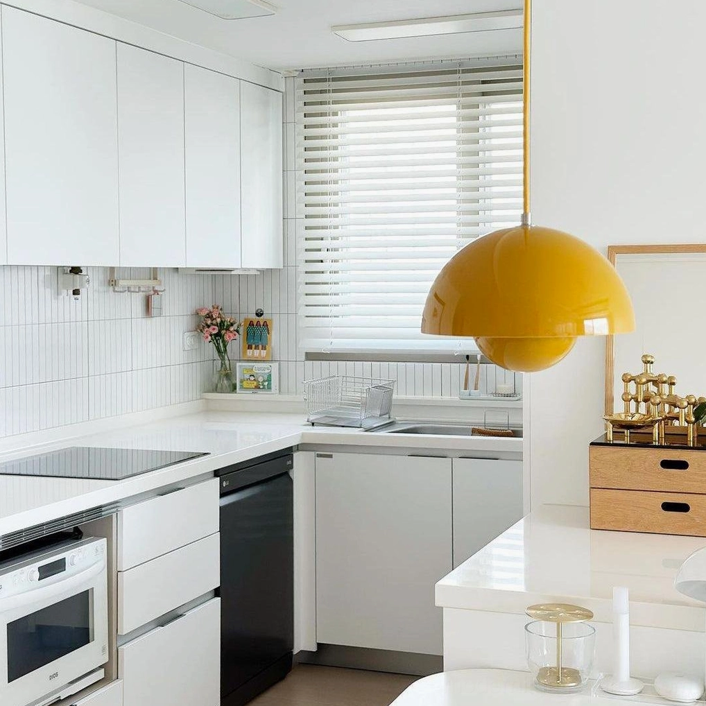 Flowerpot pendant light in yellow finish bringing bright cheerful accent to kitchen
