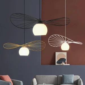 Three Fluora hat pendant lights in black gold and white finishes displayed in modern living room interior