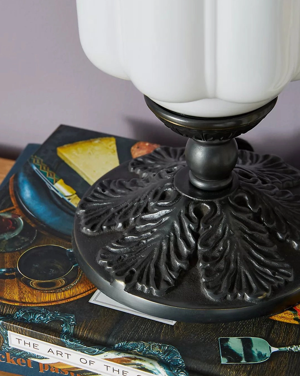Fluted glass table lamp with bronze detailing and warm illumination for bedroom nightstand display