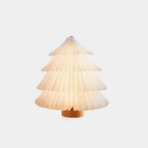 Foldable Christmas tree table lamp with warm wood base and pleated paper shade, front view on white background