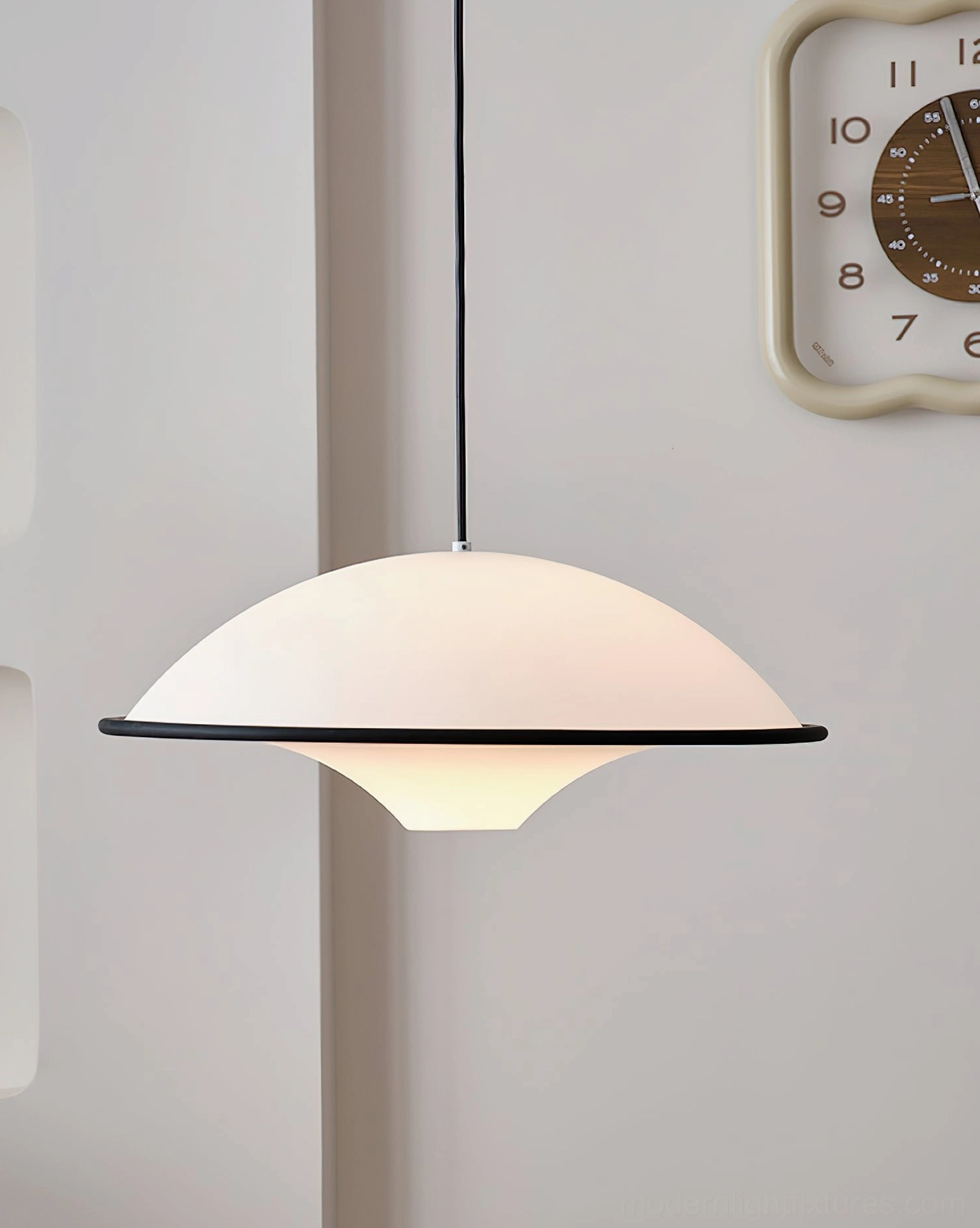 Fontana modern disc pendant lamp in hallway with matte white shade and black hanging cord
