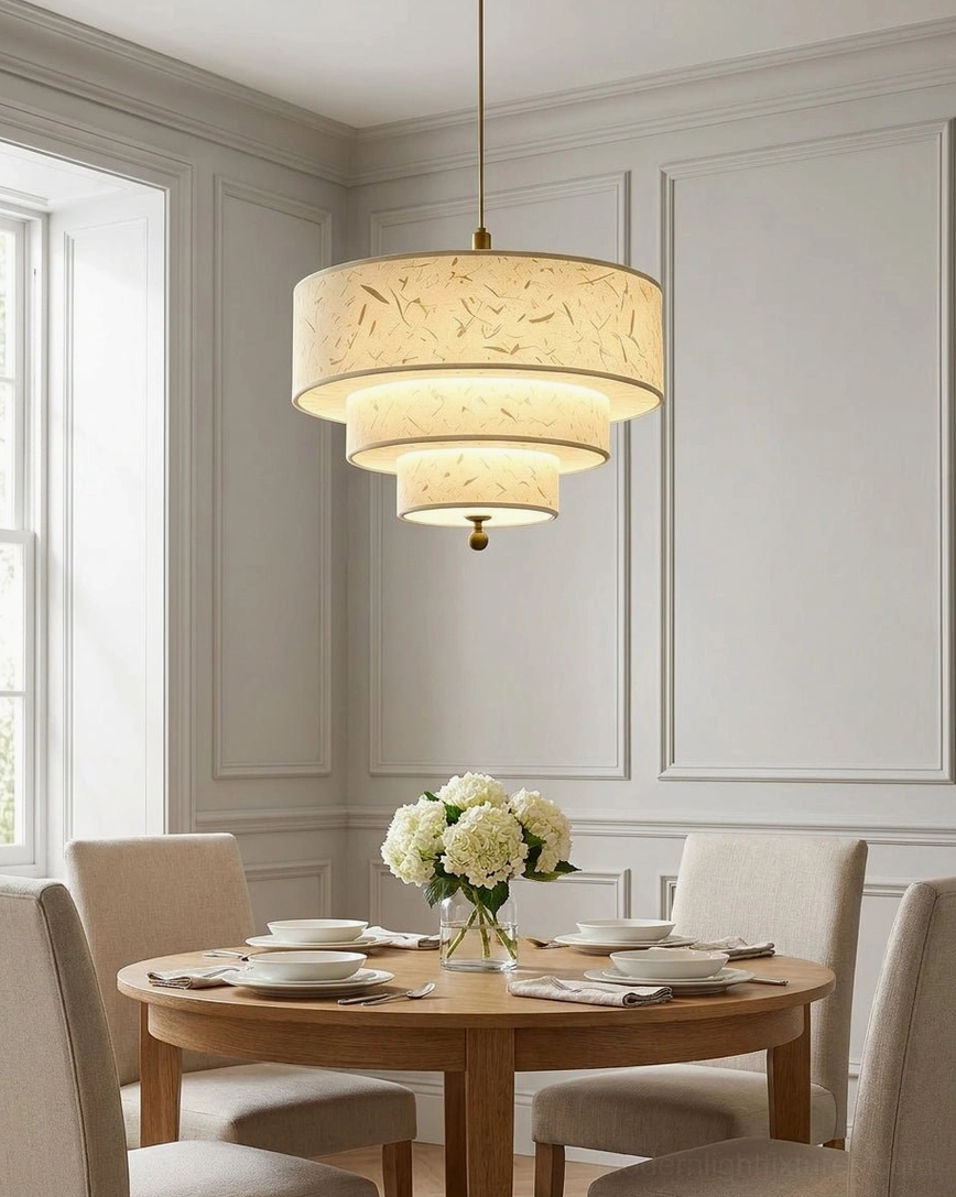 Wide-angle formal dining room with three-tier cascading drum pendant, neoclassical interior styling, cream paper shade