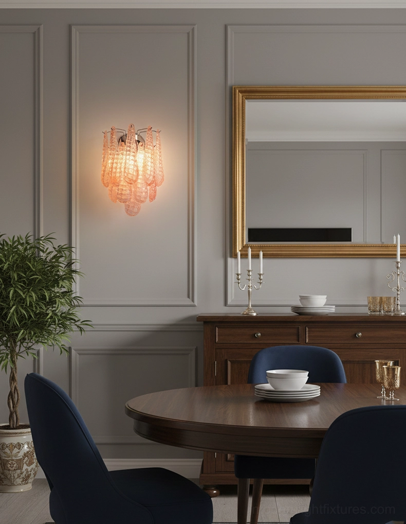 Matching glass wall sconces installed in upscale formal dining room with traditional décor