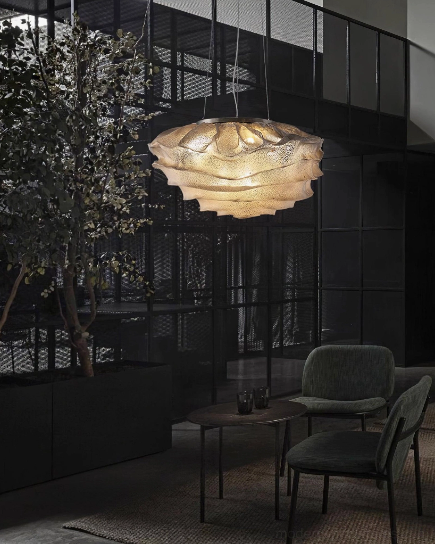 Forsyth pendant light hanging from ceiling with adjustable wire length and sloped ceiling compatible mounting