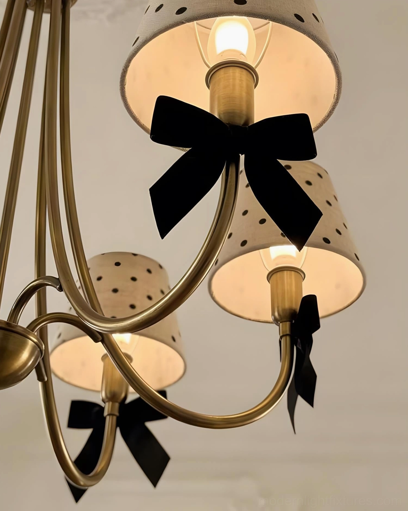 4-head parisian dot chandelier with beige polka dot shades and black bows