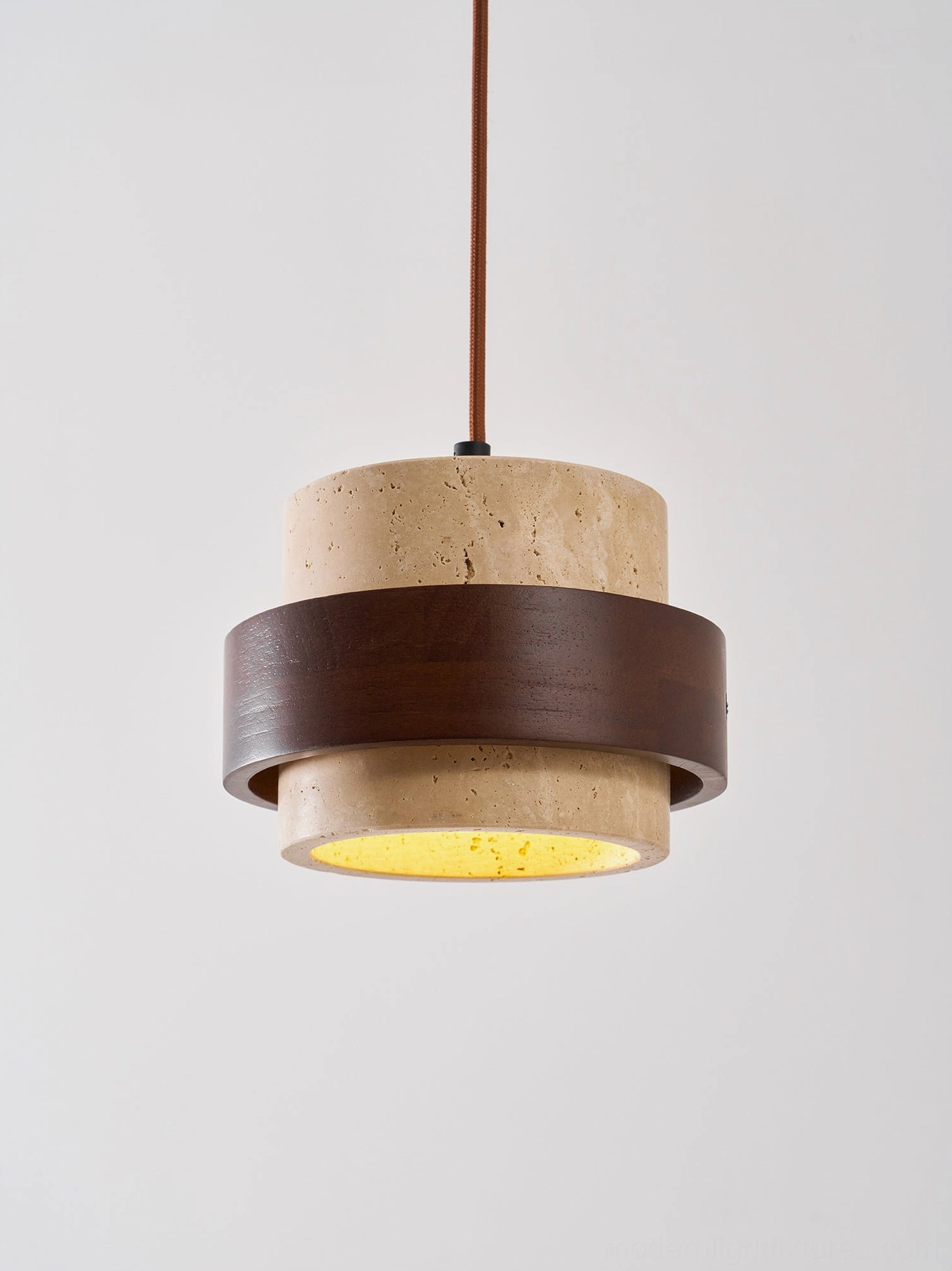 Four-head travertine pendant chandelier installation photograph, showing scale and architectural presence