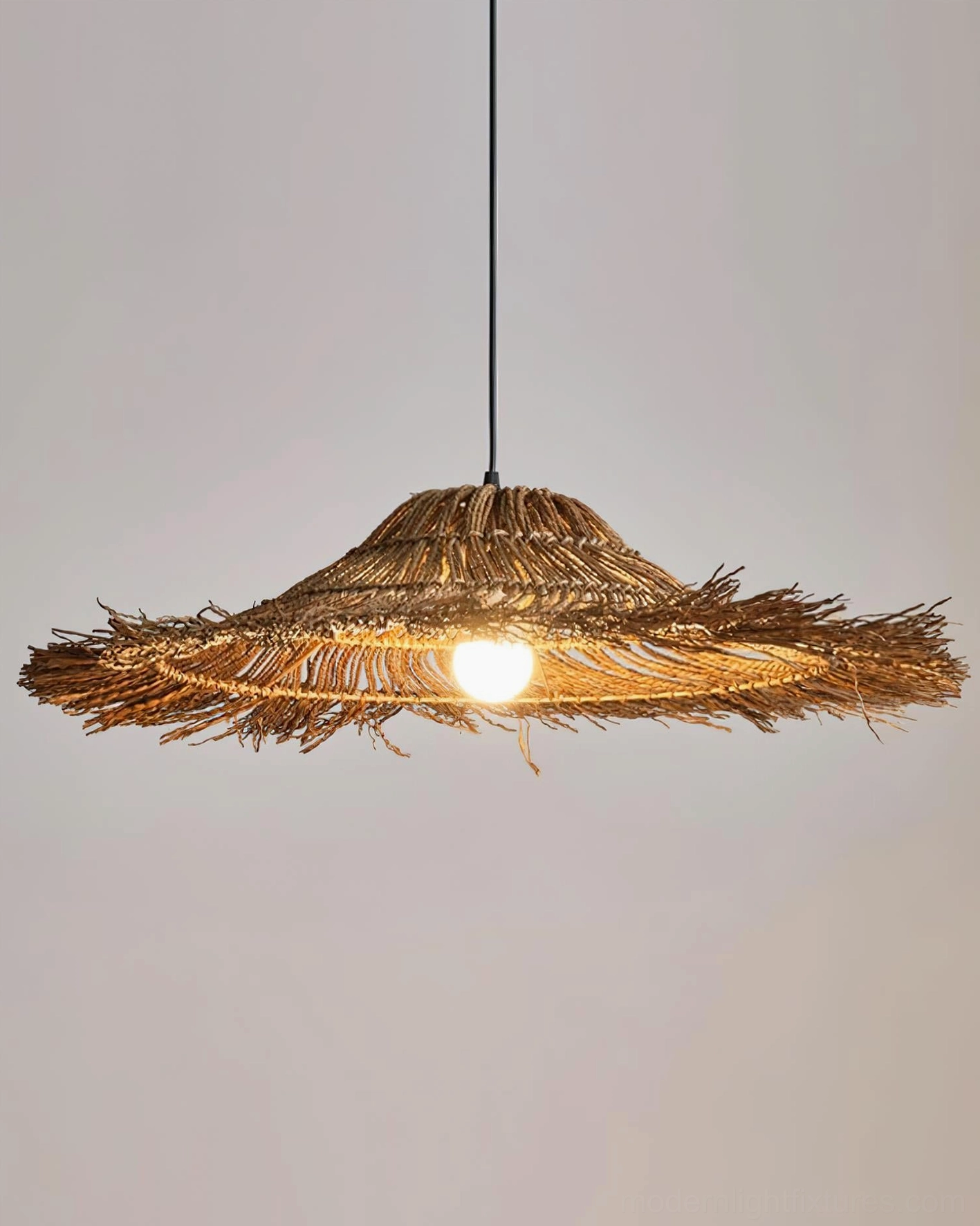 Natural rattan pendant light as focal point in foyer entryway, making bohemian luxury first impression for guests