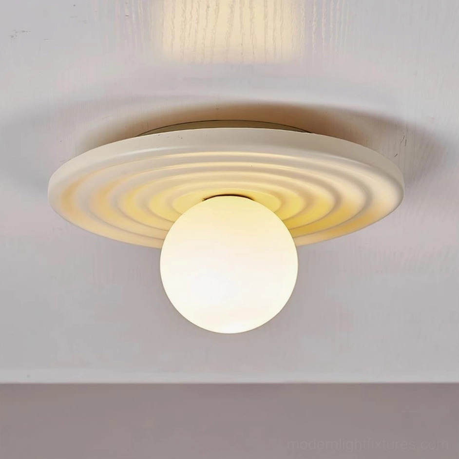 Francie disc ceiling light in beige neutral tone installed in modern residential hallway with contemporary artwork