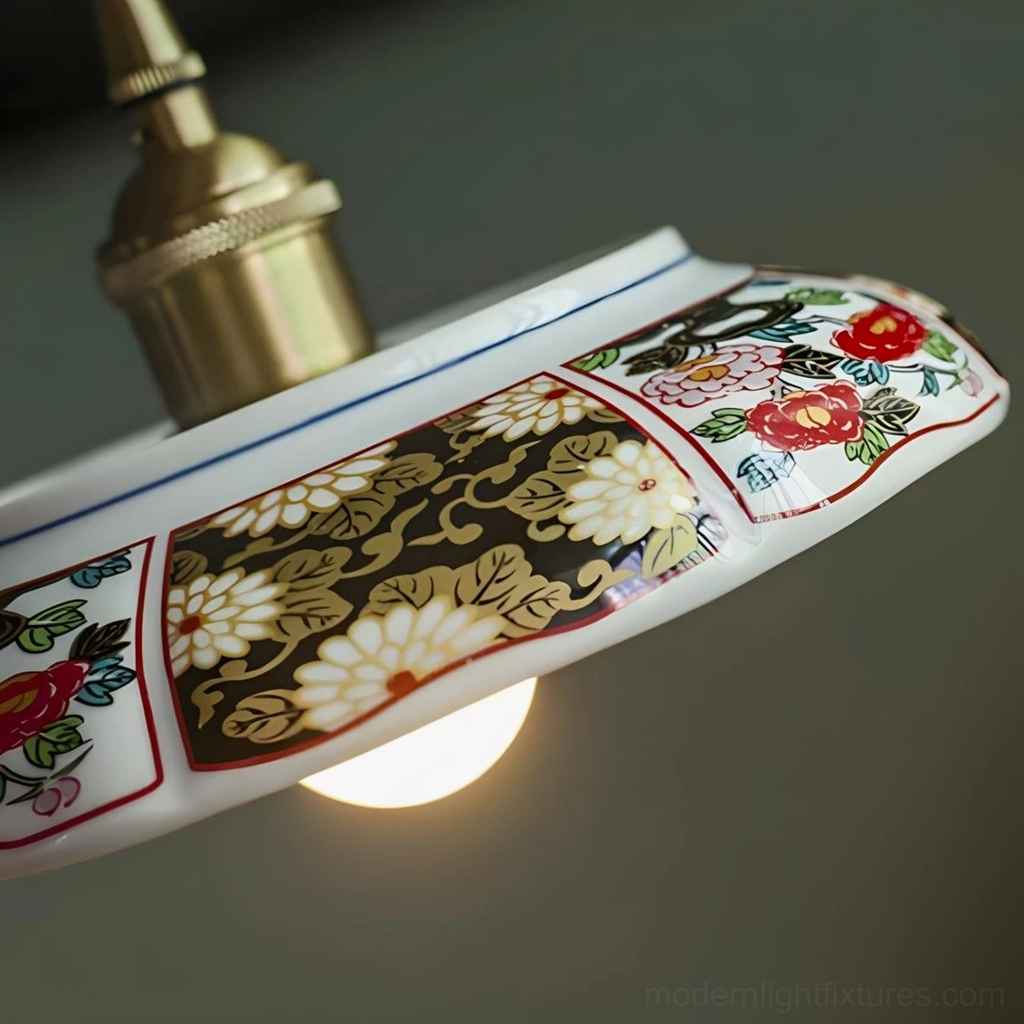 Hand-painted ceramic saucer pendant light in French country style kitchen with vintage brass accents