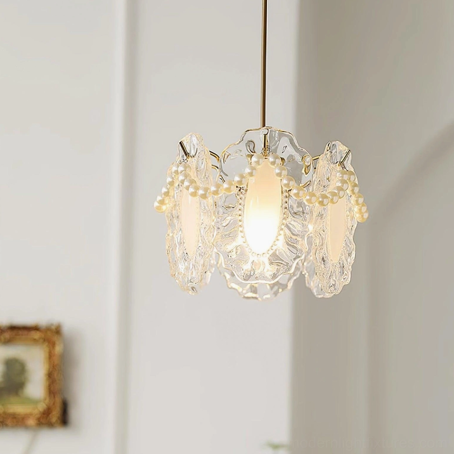 Crystal petal pendant lamp showcasing French vintage design aesthetic with delicate glass formations and warm glow