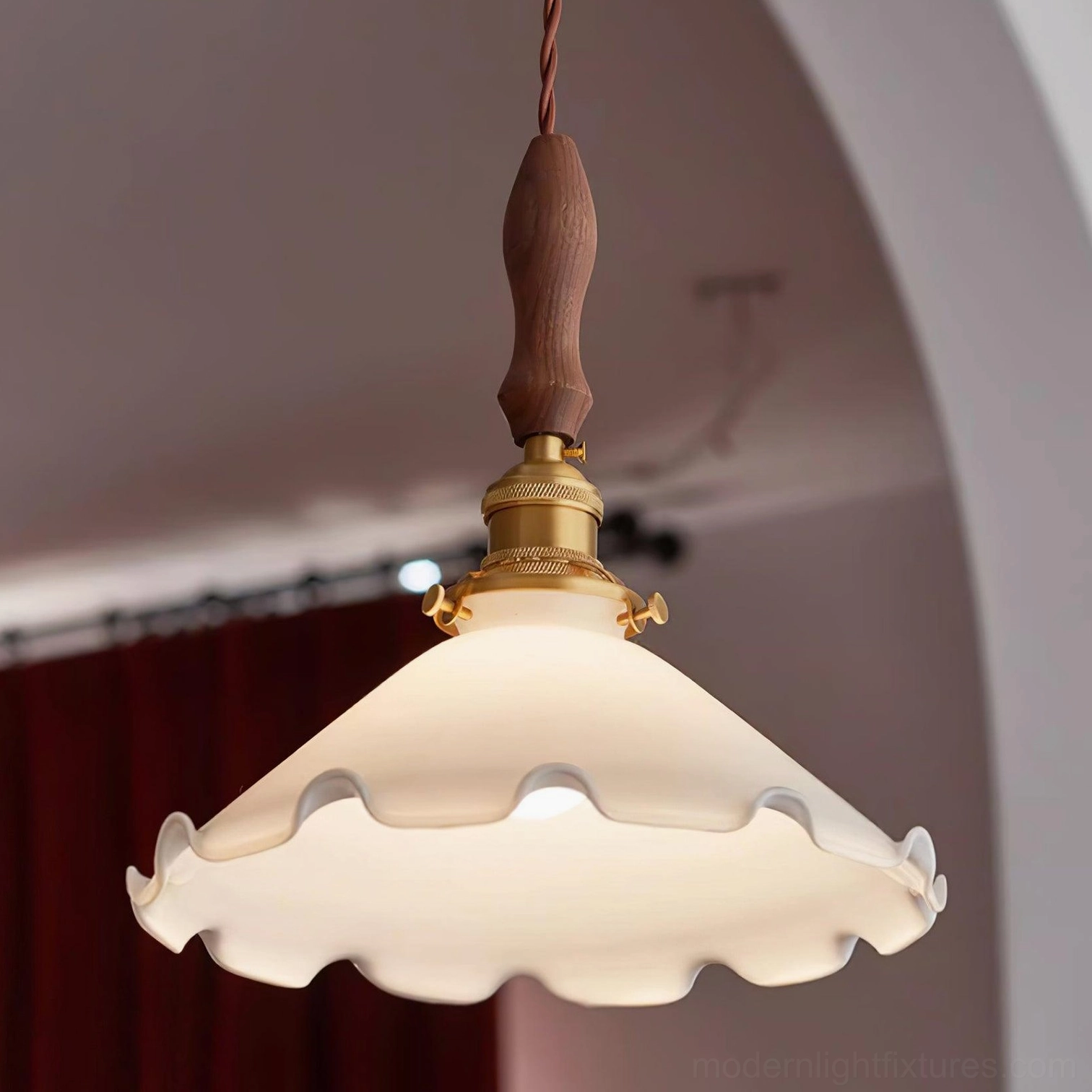 Frilled glass pendant lamp with brass and wood components, installation angle view