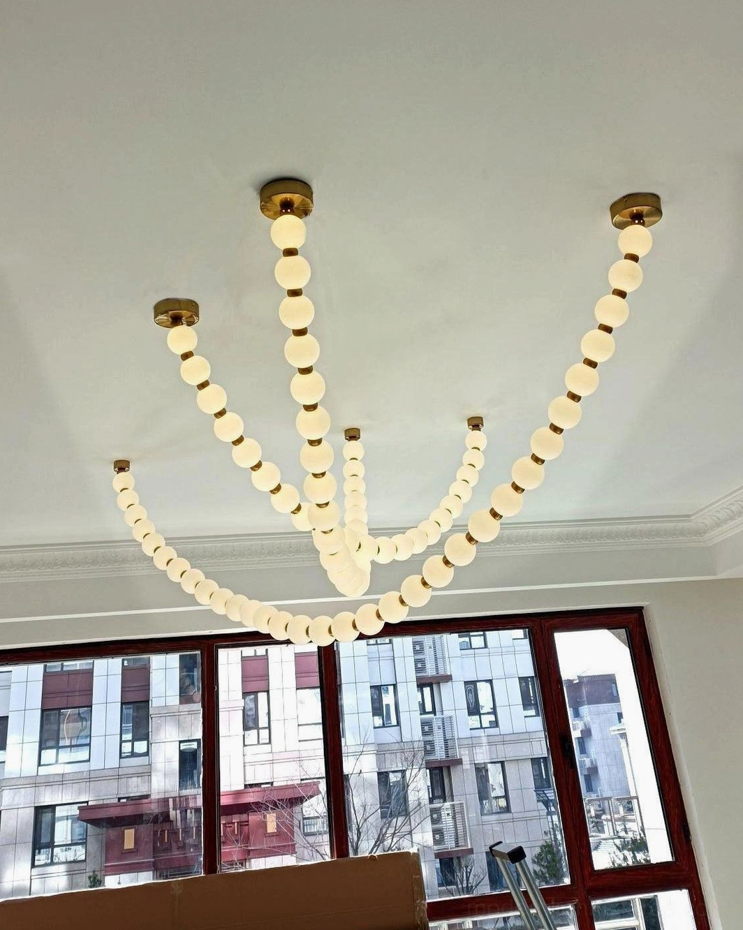 Pearl pendant light with frosted acrylic orbs creating soft diffused illumination and elegant aesthetic