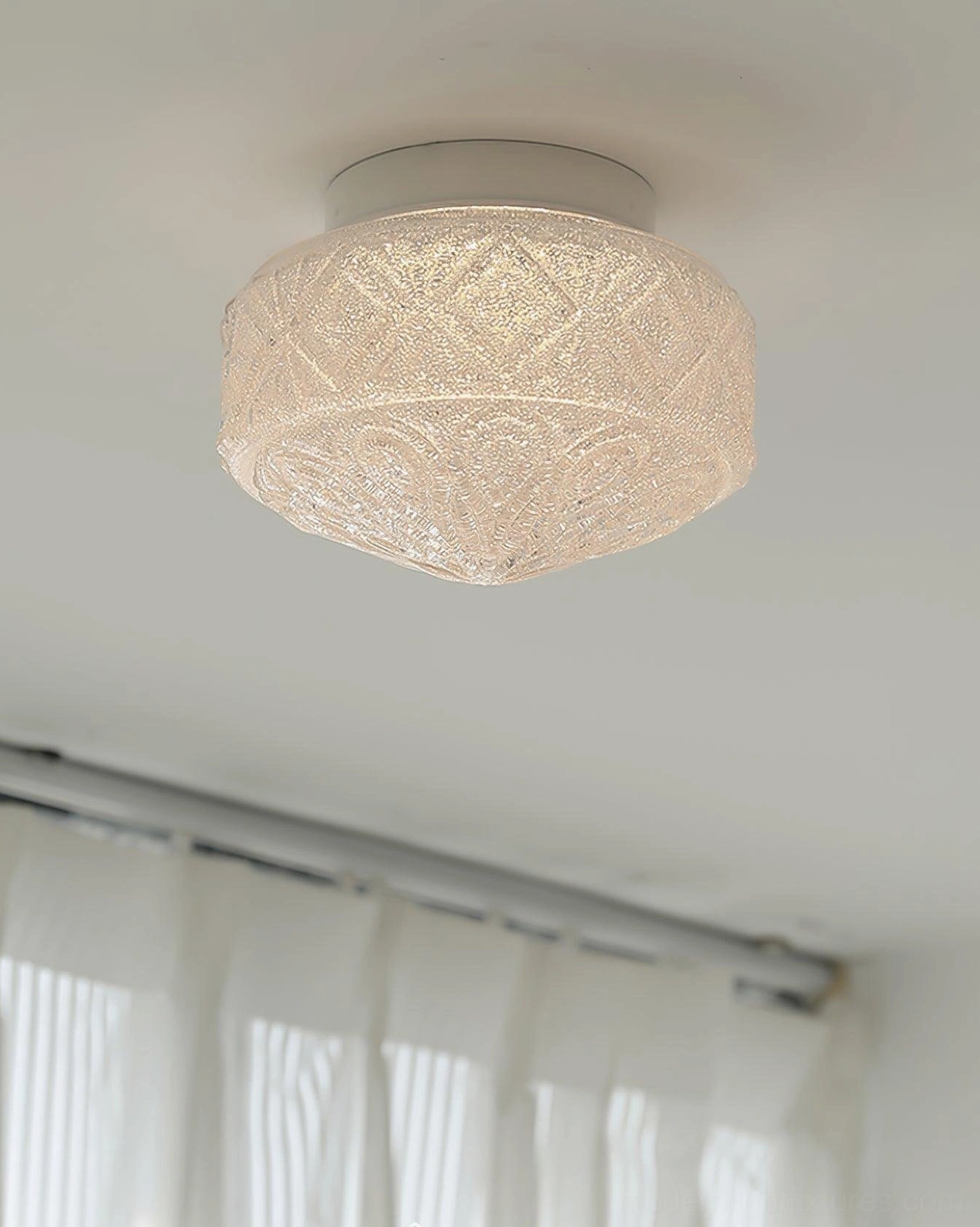 Textured frosted glass flush mount ceiling light with woven pattern showing light diffusion, front view in home interior room