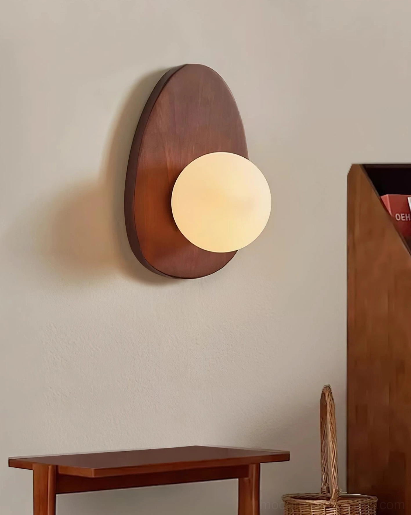 Frosted glass globe wall lamp detail showing light quality and shadow diffusion on wall surface