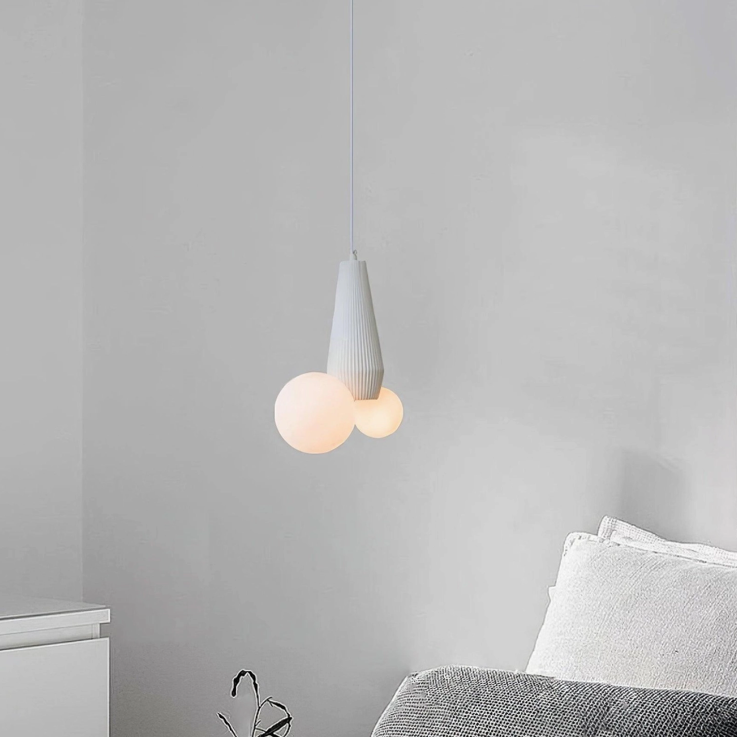 Modern pendant lighting design - frosted glass globes with decorative ribbed metal base