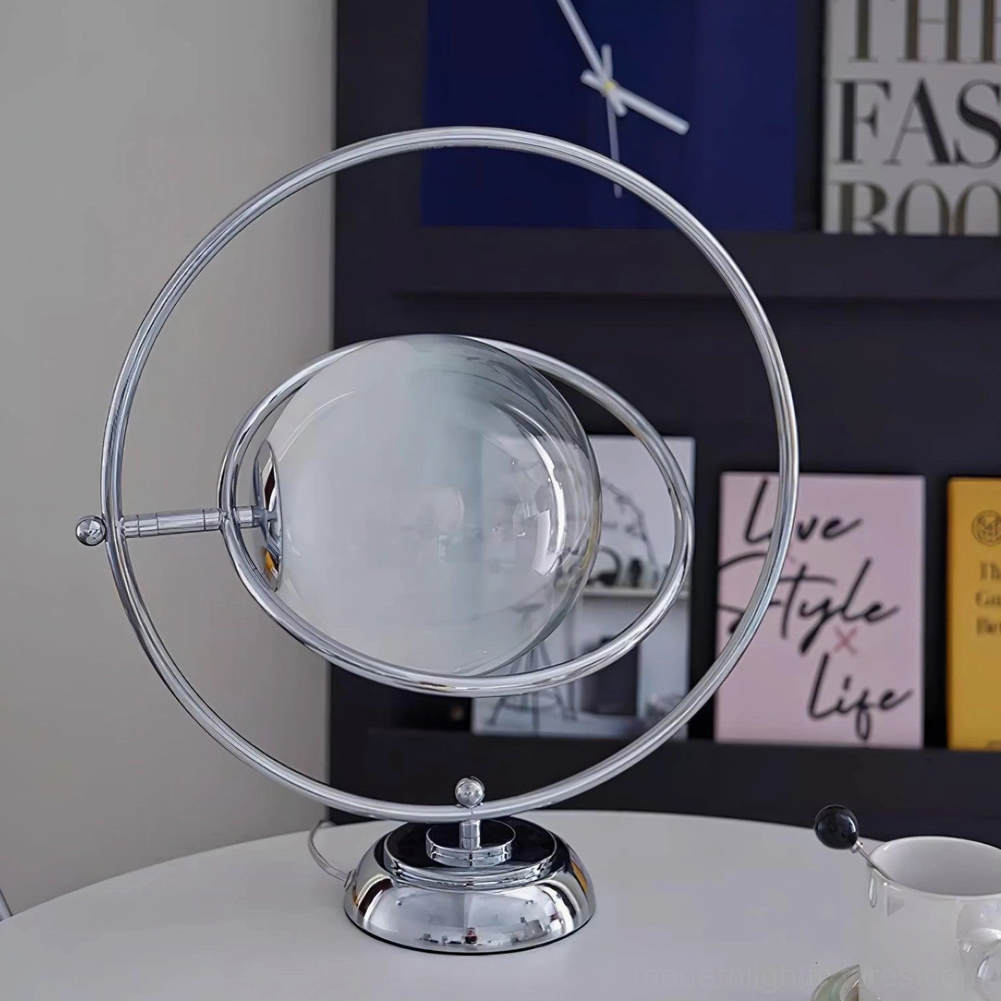Frosted glass sphere table lamp with chrome metal frame installation detail