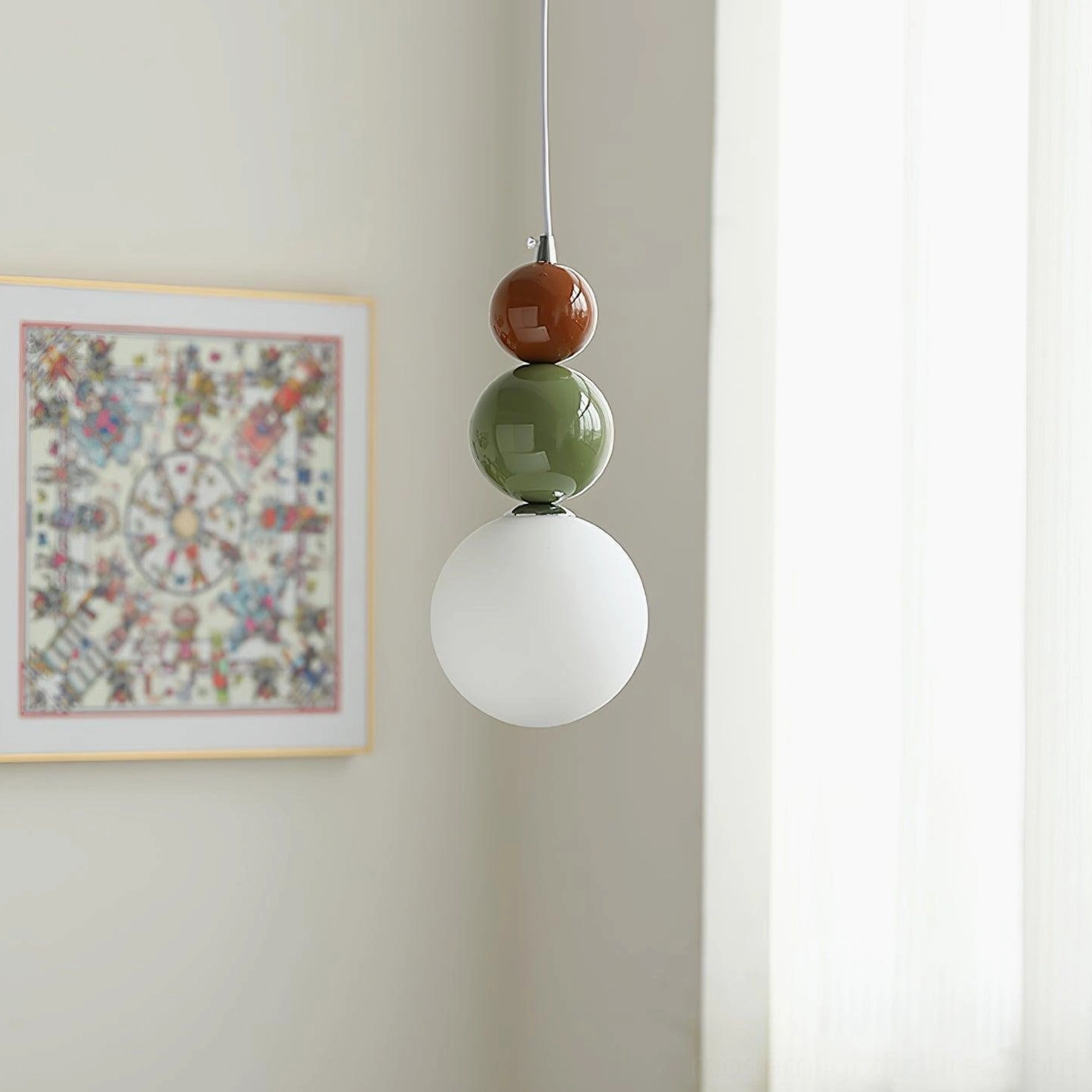 Three-sphere pendant light fixture demonstrating light diffusion through frosted white glass